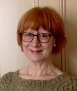 Picture of woman wearing glasses and smiing